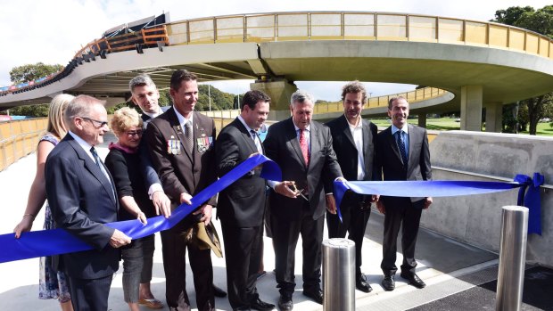 Roads Minister Duncan Gay cuts the ribbon at the bridge's opening.