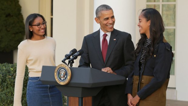 US President Barack Obama with daughters Sasha [left] and Malia. 