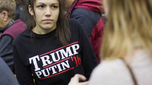 A woman wears a shirt reading 'Trump Putin '16' while waiting for Republican presidential candidate Donald Trump at Plymouth State University.