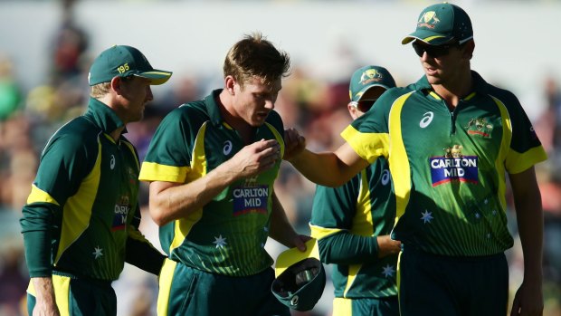 PERTH, AUSTRALIA - FEBRUARY 01:  James Faulkner of Australia is consoled by teamates as he leaves the field injured during the final match of the Carlton Mid One Day International series between Australia and England at WACA on February 1, 2015 in Perth, Australia.  (Photo by Matt King/Getty Images)