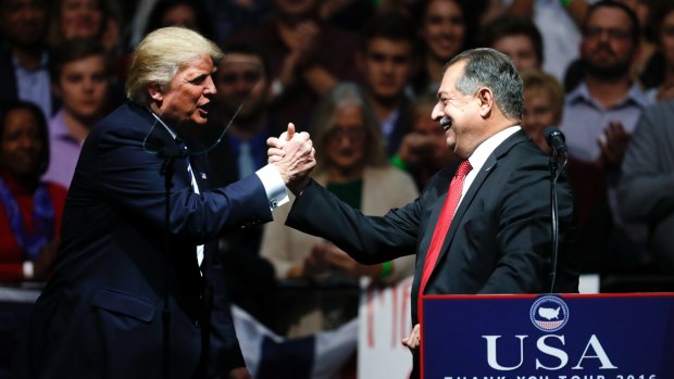 Donald Trump thanks Andrew Liveris during a rally in Michigan in December.