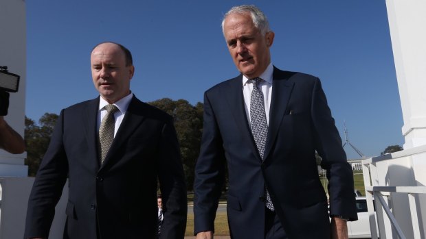 Prime Minister Malcolm Turnbull arrives for the summit with national counter-terrorism co-ordinator Greg Moriarty.