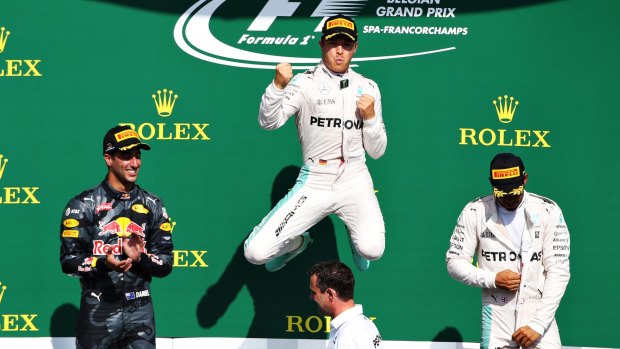 High and mighty: Mercedes driver Nico Rosberg celebrates his win.