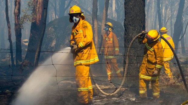 CFA firefighters protecting homes in Feeneys Lane in Benloch, near Lancefield.