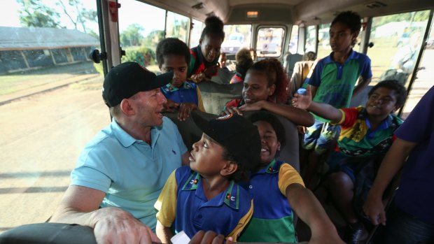 Tony Abbott joins the Remote School Attendance Strategy  bus to pick up children for school in Bamaga during his visit to Cape York in August.