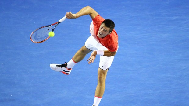 Serving up a storm:  Bernard Tomic gets play underway in his third round match against John Millman.