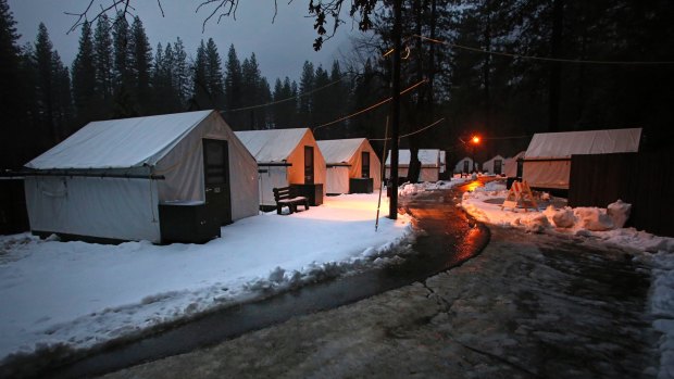 Tents stand empty at Half Dome Village in Yosemite National Park, California after being evacuated ahead of possible flooding of the Merced River from a storm system in Northern California.