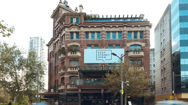 A Keep Sydney Open banner, installed on the Kings Cross Hotel, has angered some local residents.