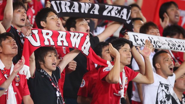 Huge following: Urawa fans cheer during the Asian Champions League match against the Brisbane Roar last year.