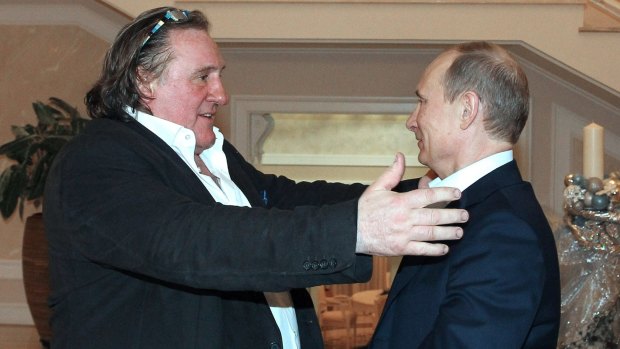 French actor Gerard Depardieu, left, greets Russian President Vladimir Putin in 2013.