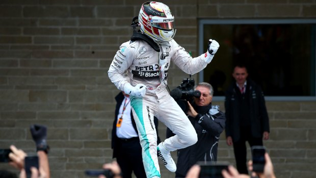 Lewis Hamilton enjoys his victory.