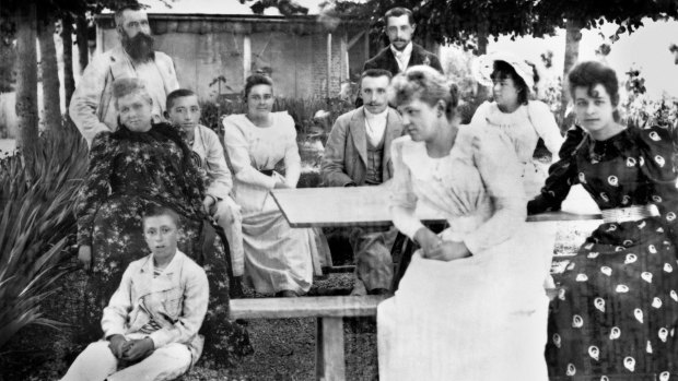 The Monet-Hoschede family under the lime trees at Giverny in 1886, Claude Monet top left, his two sons at left and his wife's daughters at right. 