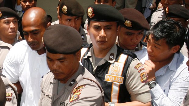 Australians Myuran Sukumaran (L) and Andrew Chan (R) are escorted by Indonesian police.