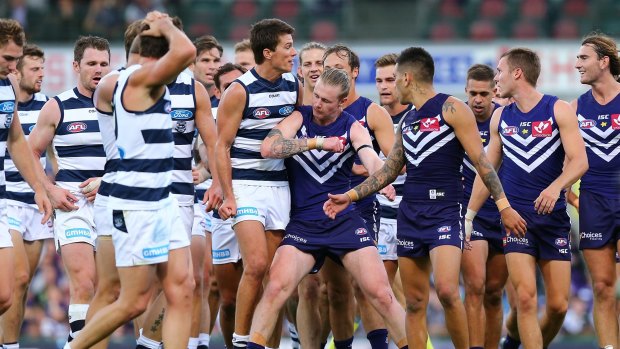 Argy bargy: Cam McCarthy takes issue with Geelong's Andrew Mackie at the half-time break.