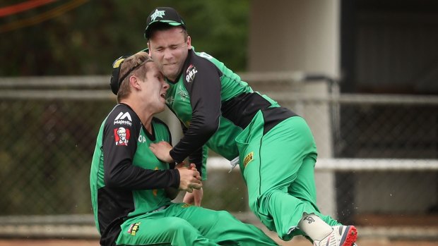 Adam Zampa and Tom Triffitt of the Melbourne Stars collide in the outfield against the Sydney Thunder.