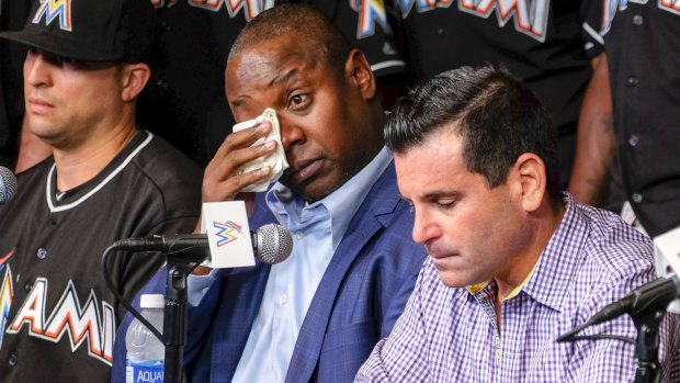 Michael Hill, Marlins president of baseball operations, wipes his tears during a press conference to announce the death of Fernandez. 