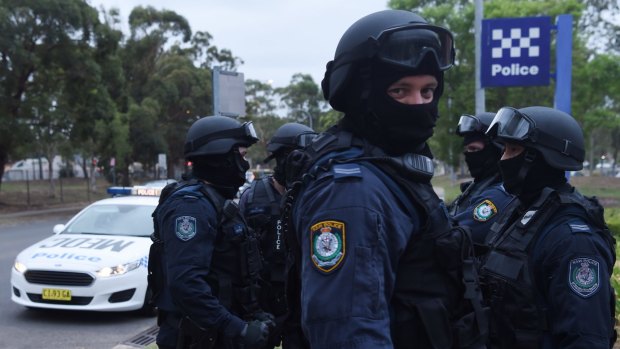 Members of the Middle Eastern Organised Crime Squad raid a house in western Sydney to look for suspected firearms.
