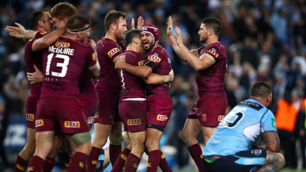 The great escape: Johnathan Thurston and the Maroons celebrate another unlikely win.