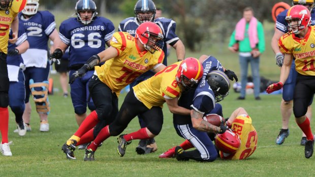 The University of Canberra Firebirds won the ACT Gridiron Capital Bowl in remarkable fashion.?Brendan Morrissey (76),?Max Murdoch (6), and Ian Lanham (23) make a tackle.