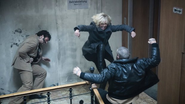 Charlize Theron, centre, punches through her paces in <i>Atomic Blonde</i>.