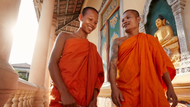 Two Buddhist monks in a temple.