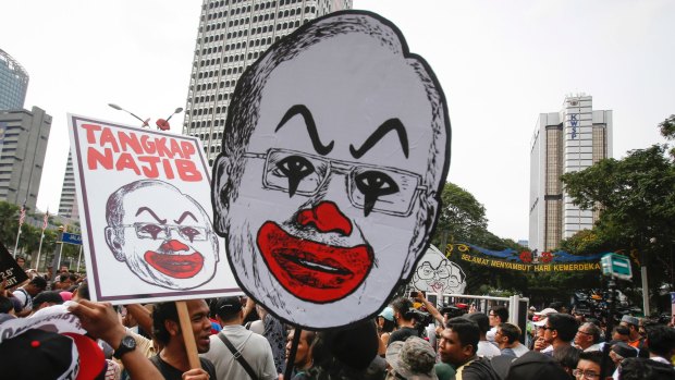 Student activists hold up a caricature of Malaysian Prime Minister Najib Razak in Kuala Lumpur in August.