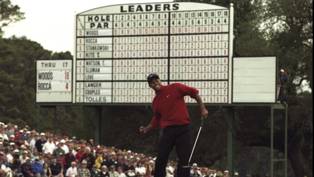 In full flight: Tiger Woods wins the Masters at Augusta in 1997.