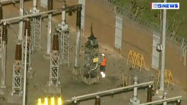A worker inspects equipment at Meadowbank substation, where residents heard a loud bang.