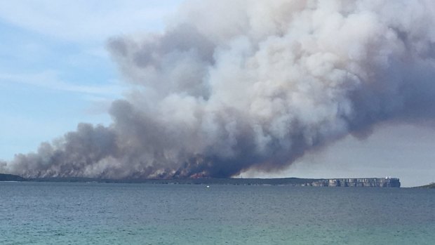 Smoke billows from the fire on Beecroft Peninsula, as seen from Green Patch campground, Booderee National Park.