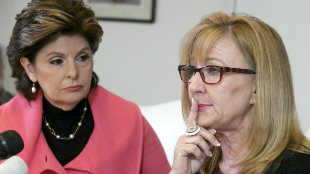 Lawyer Gloria Allred listens as an accuser, Janice Baker Kinney, speaks during a news conference in April as three women alleged comedian Bill Cosby victimised them.