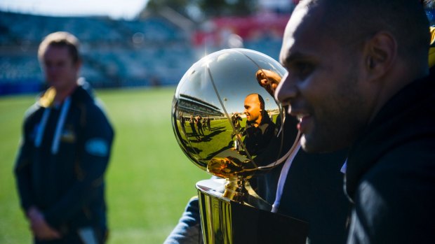 Patrick "Patty" Mills at Canberra Stadium with the NBA trophy last year.