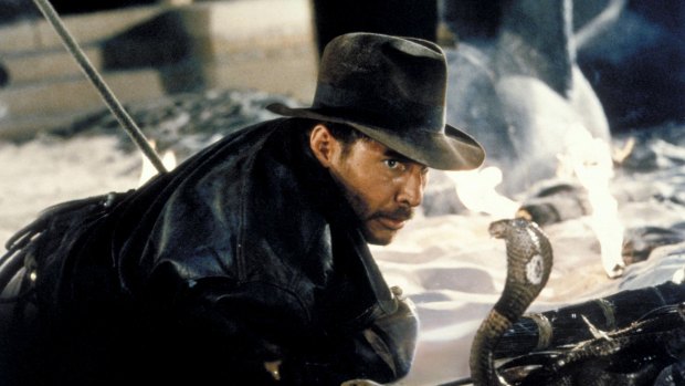 Actor Harrison Ford comes face-to-face with a cobra in a scene from the first of four Indiana Jones films.