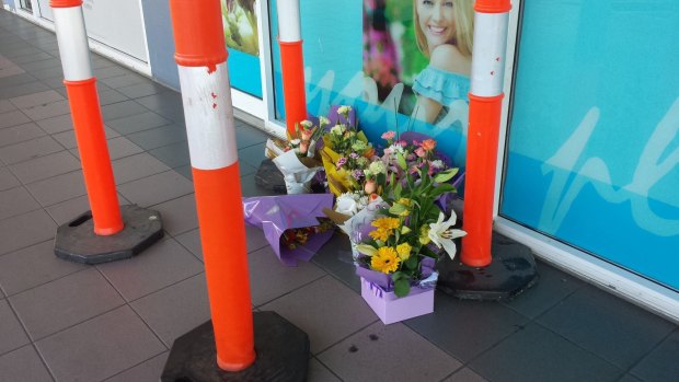 A makeshift tribute for a man who died after an altercation at Logan Central Plaza.