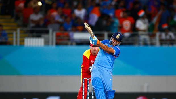 Man of the match Suresh Raina hits a six during his unbeaten knock of 110.