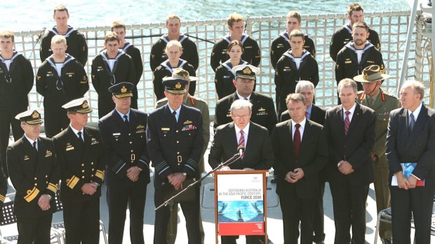 Big spender ... Kevin Rudd (at the podium) launches his white paper aboard the HMAS Stuart in 2009.