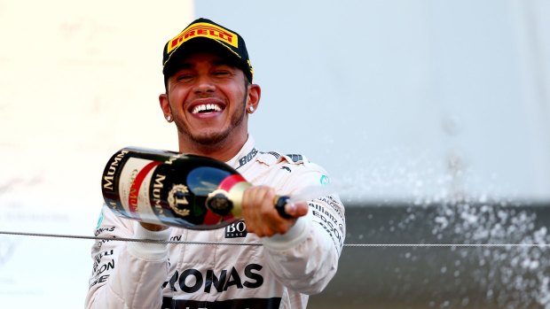 Lewis Hamilton celebrates his victory.