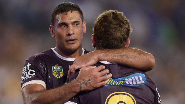 Justin Hodges consoles Andrew McCullough of the after their defeat.
