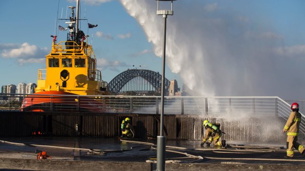 Helping hand: The fire was knocked over with the help of a Port Authority boat.