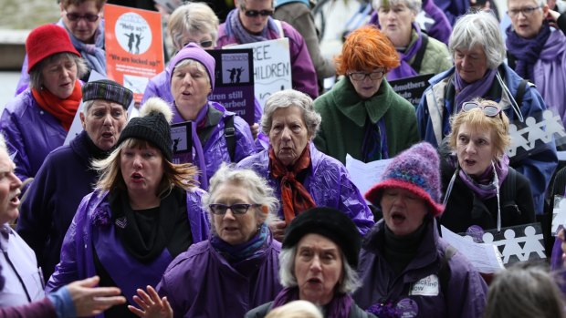 Grandmothers against detention of refugee children sing songs as they rally outside the ALP National Conference. 