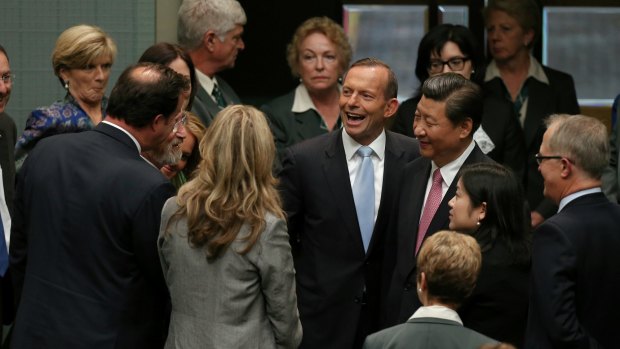 Chinese President Xi Jinping is introduced to members and senators by Prime Minister Tony Abbott following his address. 