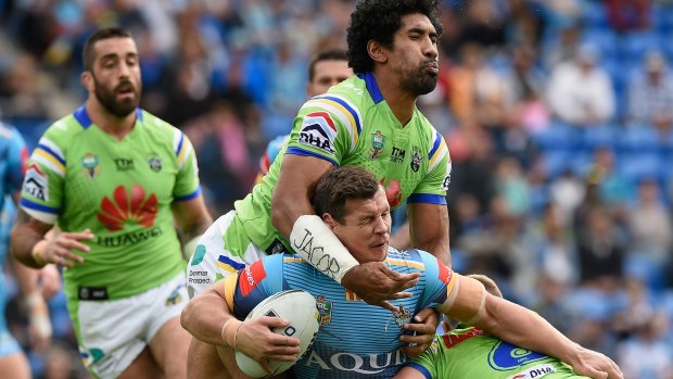 Sia Soliola tackles Greg Bird in Canberra's win over Gold Coast on Sunday. 