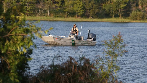 Officers from Florida Fish and Wildlife search for the two-year-old boy.