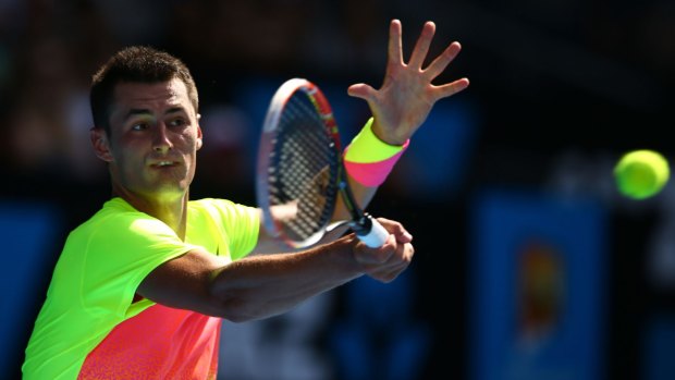 Bernard Tomic plays a forehand during his win on Monday.