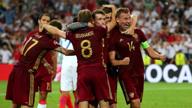Russian delight: Denis Glushakov celebrates scoring.