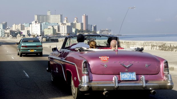 Time for change: A classic American car on Malecon Avene in Havana.