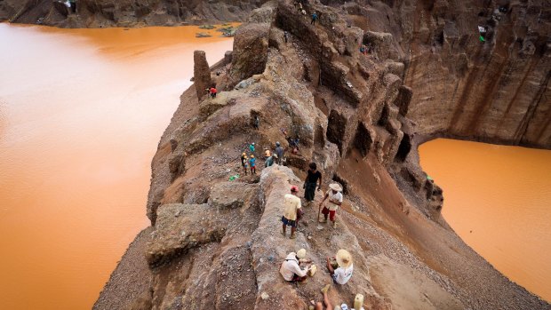 Jade miners on a jade mountain in Hpakant area of Kachin State, Northern Myanmar, in 2014.