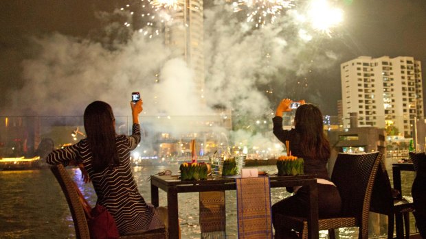 Loy Kratong Festival fireworks seen from across Chao Phraya River.