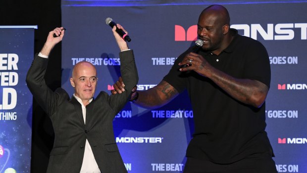Shaquille O'Neal on stage with Monster's Vern Smith.