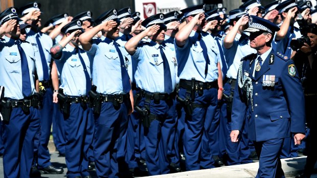 Andrew Scipione marches out of Bankstown Police Station where he began his career 37 years ago.