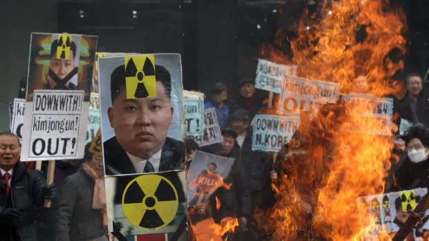 Rising tension: South Korean protesters burn an effigy of North Korea leader Kim Jong-Un at a rally in Seoul on Thursday.
